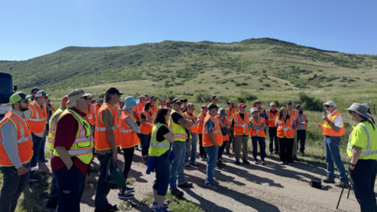 NISP Lead Project Manager speaks to a tour group at the future site of Glade Reservoir.