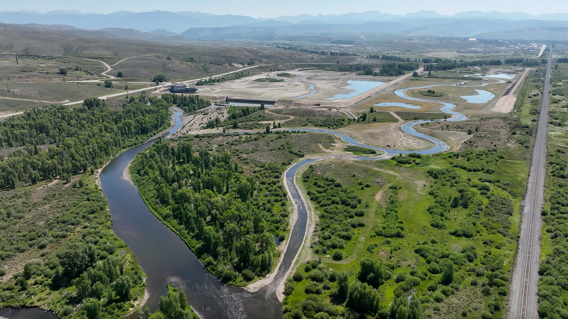 Aerial image shows the Colorado River Connectivity Channel with the smaller footprint of Windy Gap Reservoir