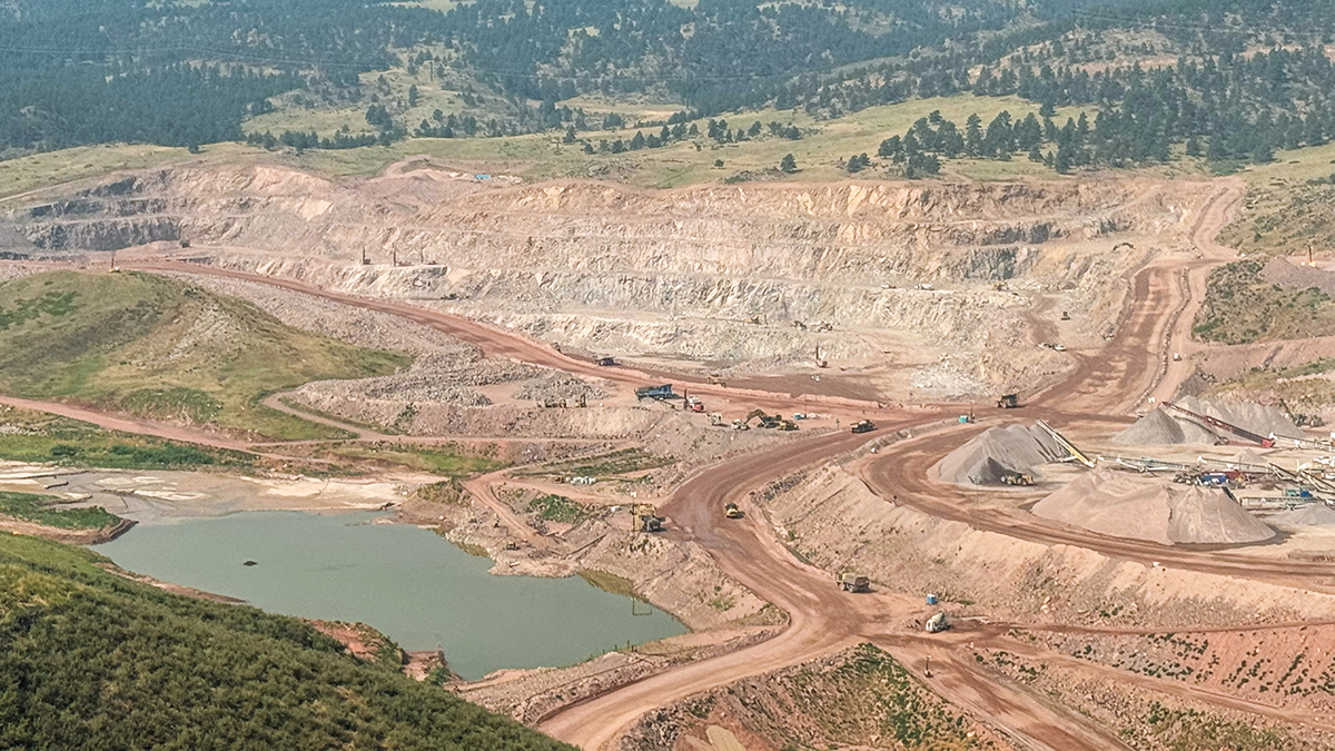 Quarry at Chimney Hollow Reservoir looking west with visible layers of rock