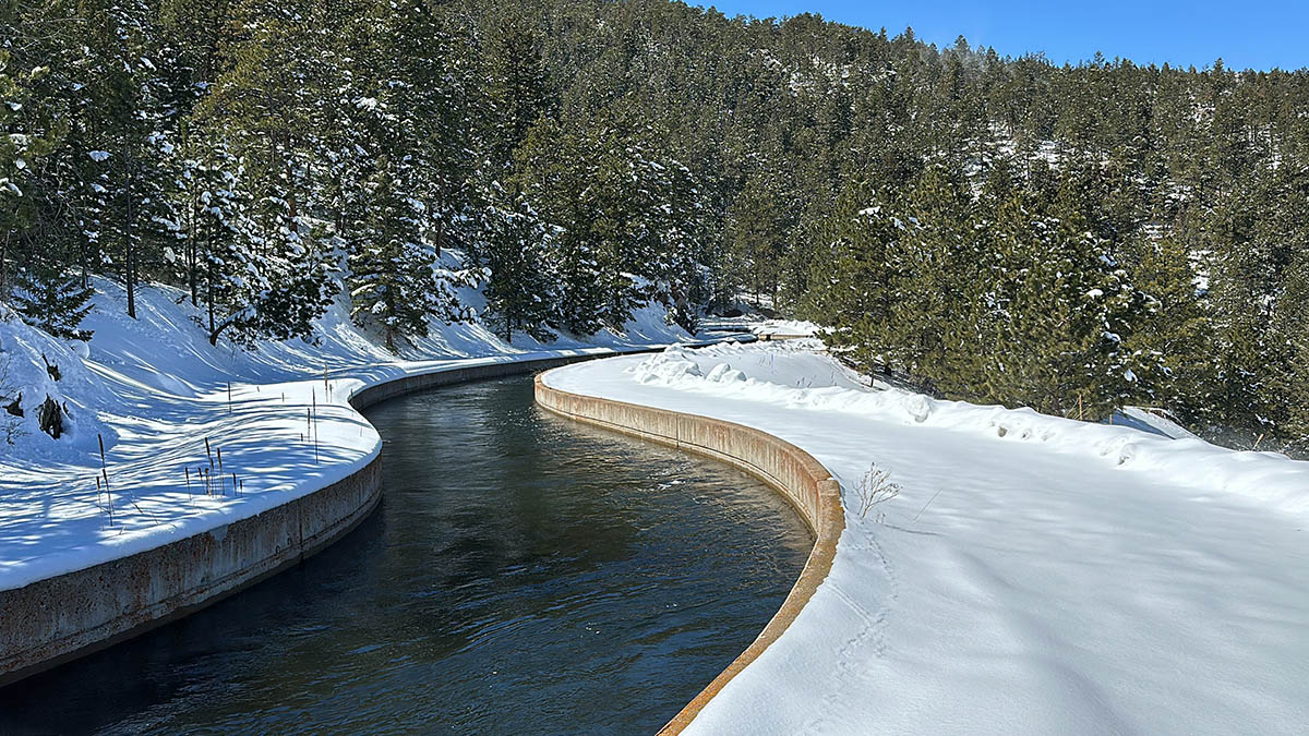 Colorado-Big Thompson Project water flows through canal in the winter.