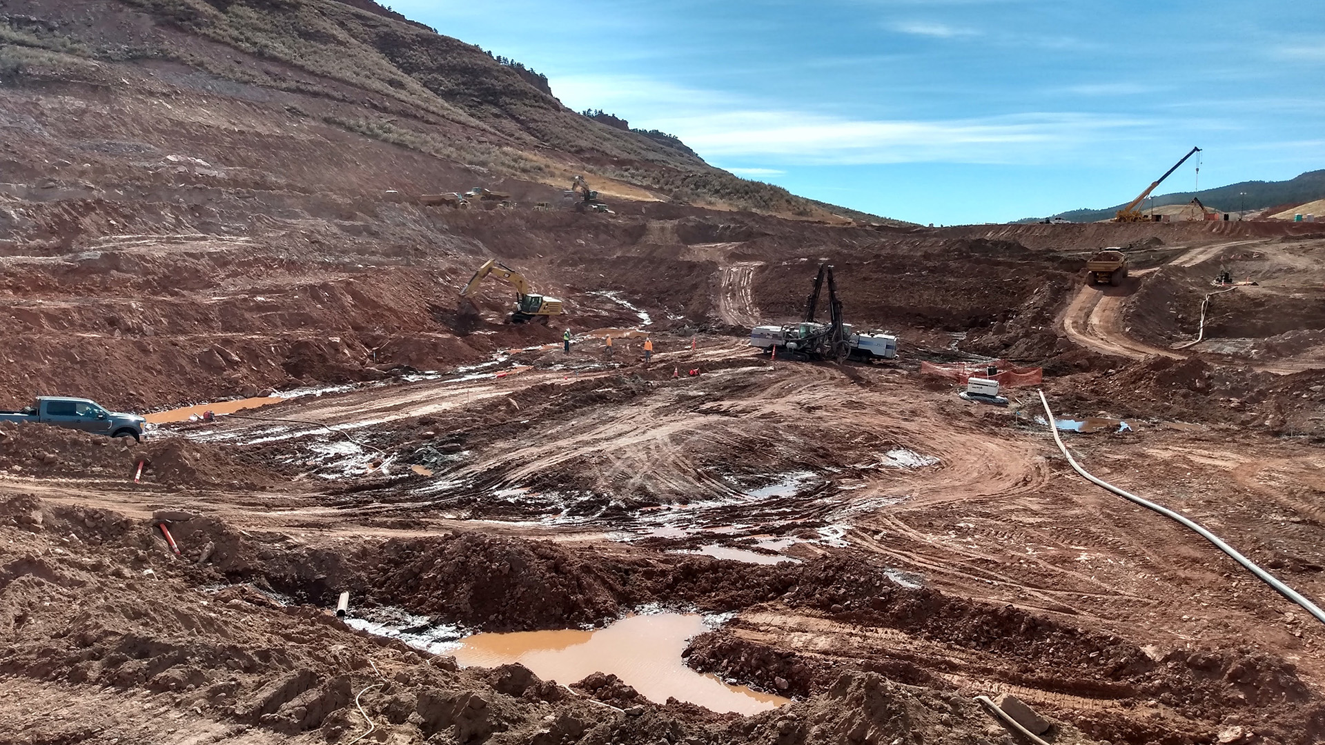 Excavation at the main dam has started to expose and clean the bedrock foundation.