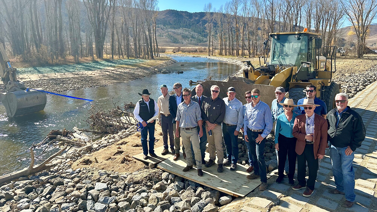 Group of people doing ribbon cutting of Colorado River Connectivity Channel