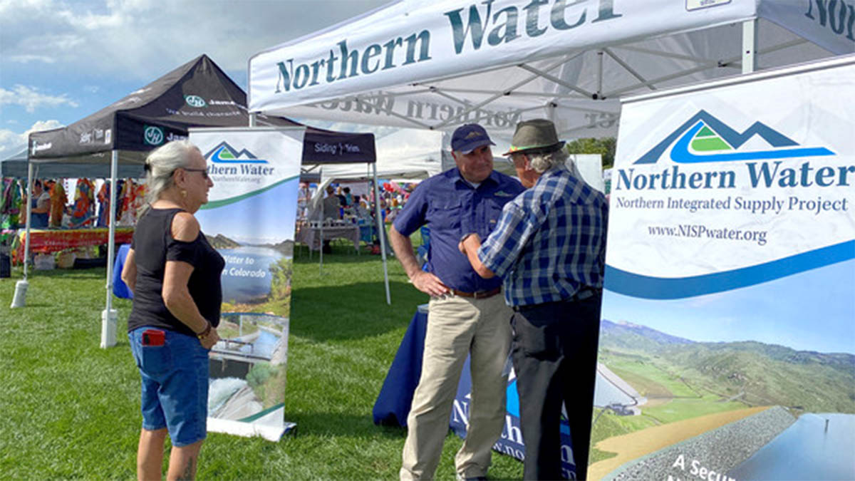 Northern Water employee talking to residents at community event