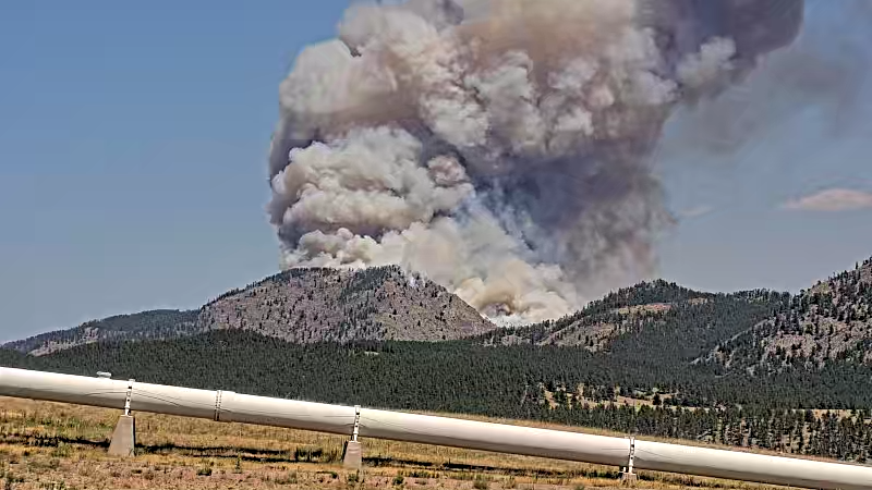 The Alexander Mountain Fire seen in the distance north of the Flatiron Penstocks west of Loveland