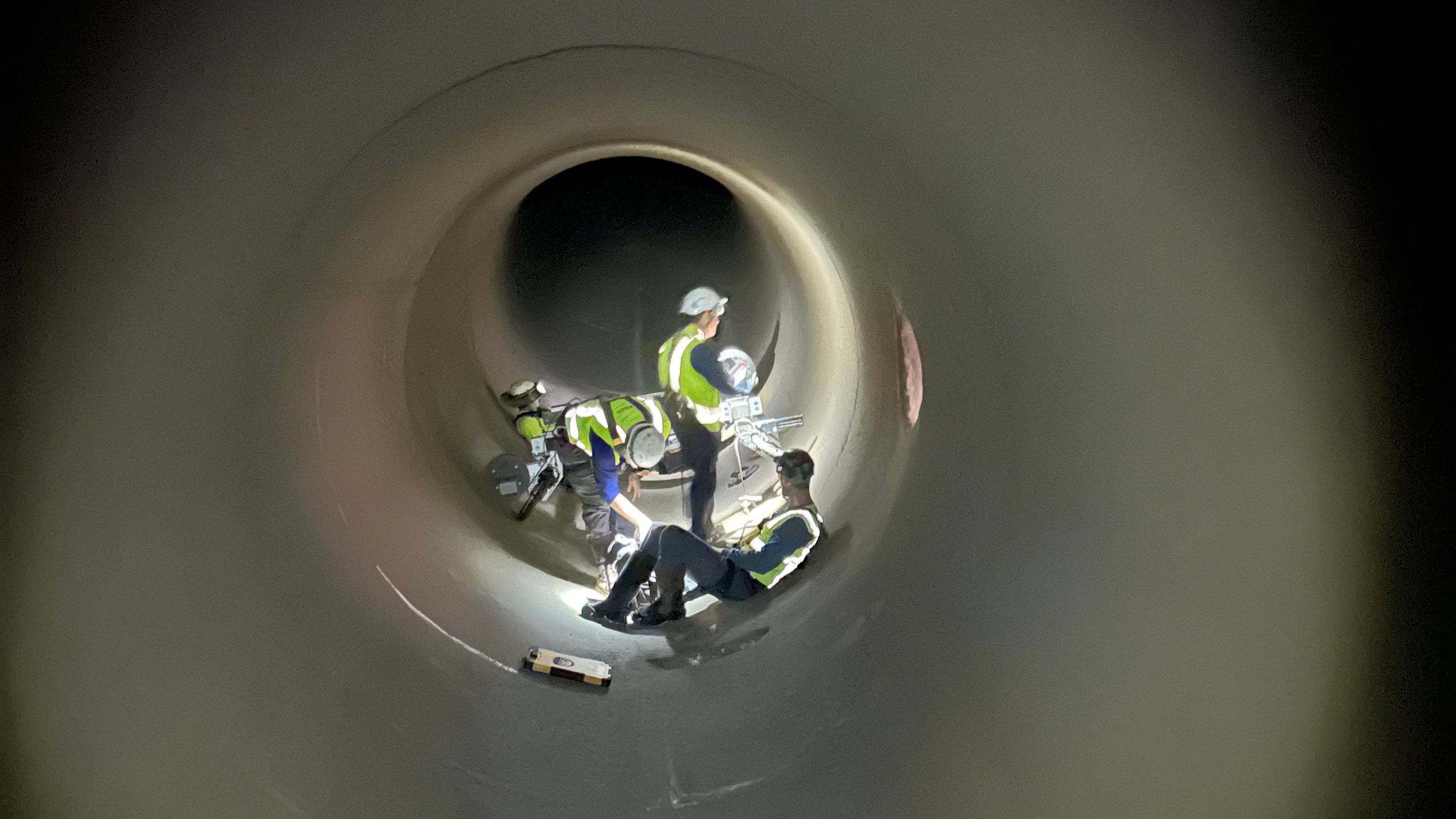 Crews work inside of the Windy Gap Pipeline